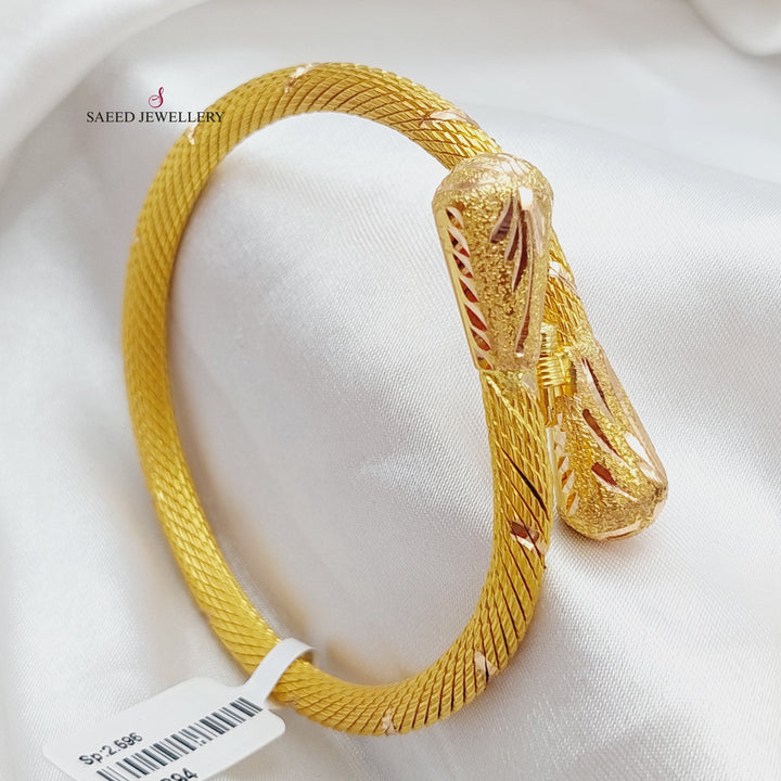 21K Gold Twisted Bangle Bracelet by Saeed Jewelry - Image 1