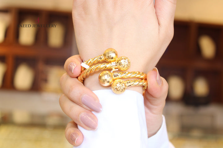 21K Gold Twisted Bracelet by Saeed Jewelry - Image 1