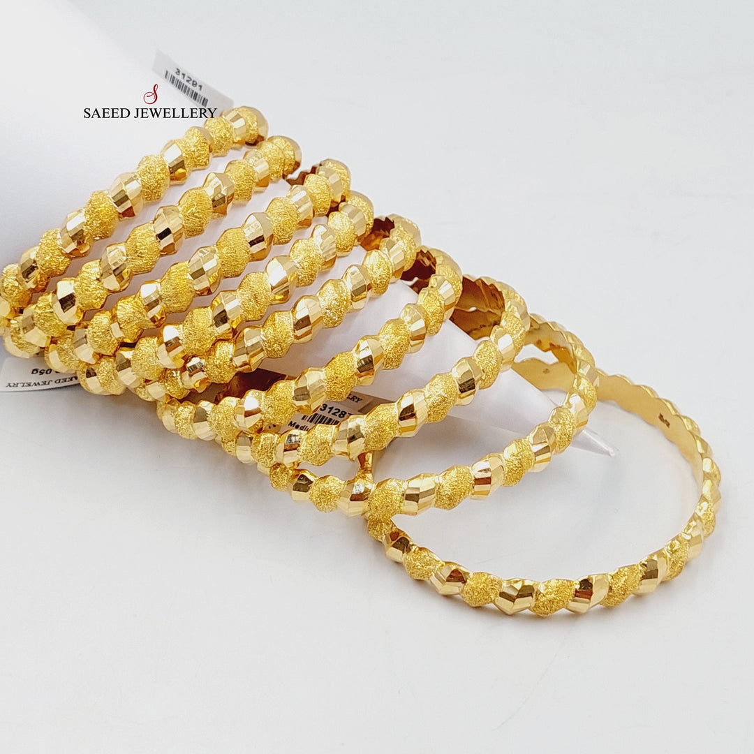 21K Gold Sanded Twisted Bangle by Saeed Jewelry - Image 1