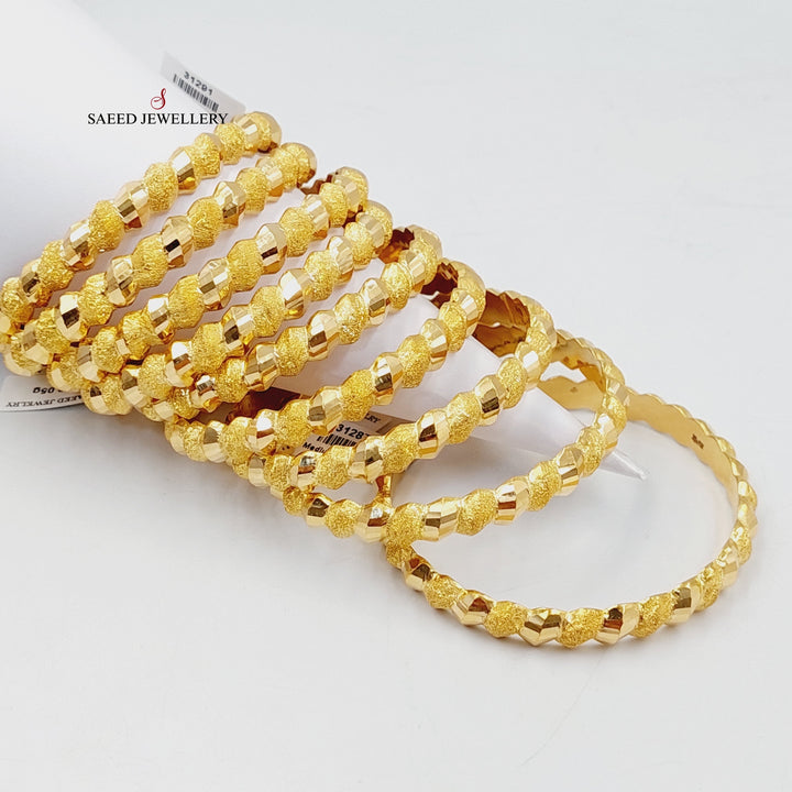 21K Gold Sanded Twisted Bangle by Saeed Jewelry - Image 1