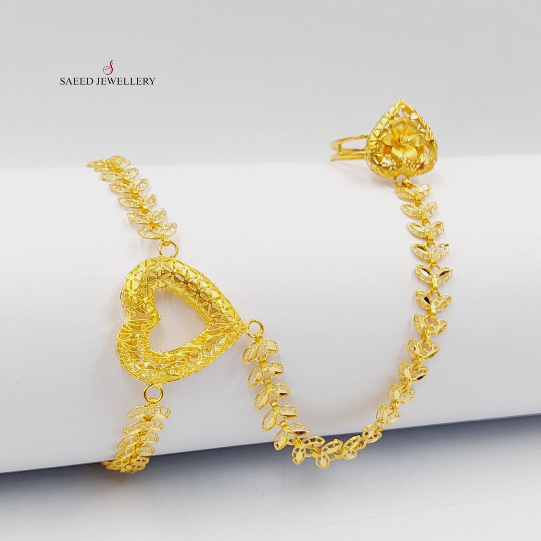 21K Gold Deluxe Heart Hand Bracelet by Saeed Jewelry - Image 1