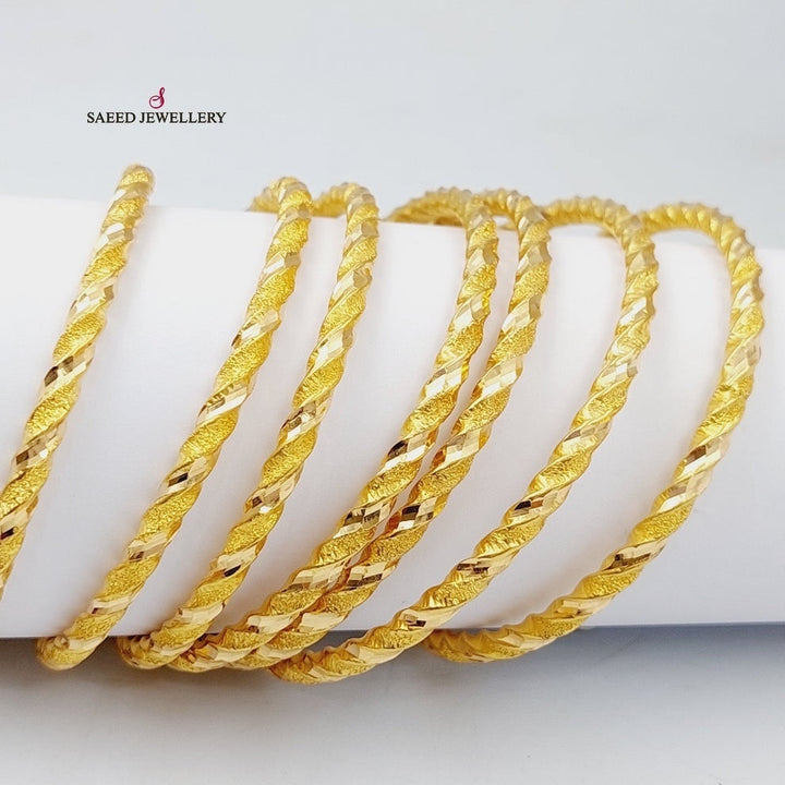 21K Gold Twisted Hollow Bangle by Saeed Jewelry - Image 1
